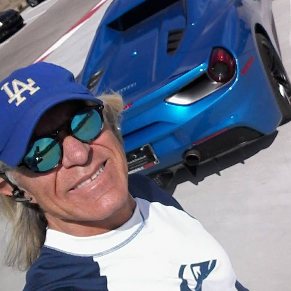 Eric Gilbert Malibu surfer relaxing with his Ferrari